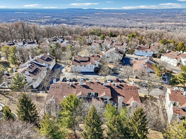 bird's eye view featuring a residential view and a forest view