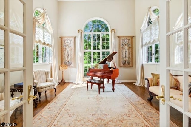 sunroom / solarium with french doors and a healthy amount of sunlight