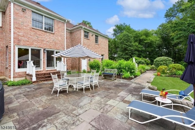 view of patio / terrace featuring entry steps and outdoor dining space