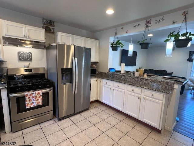 kitchen featuring appliances with stainless steel finishes, white cabinets, under cabinet range hood, and a peninsula