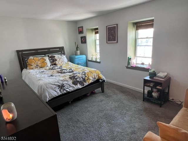 bedroom with carpet floors and baseboards