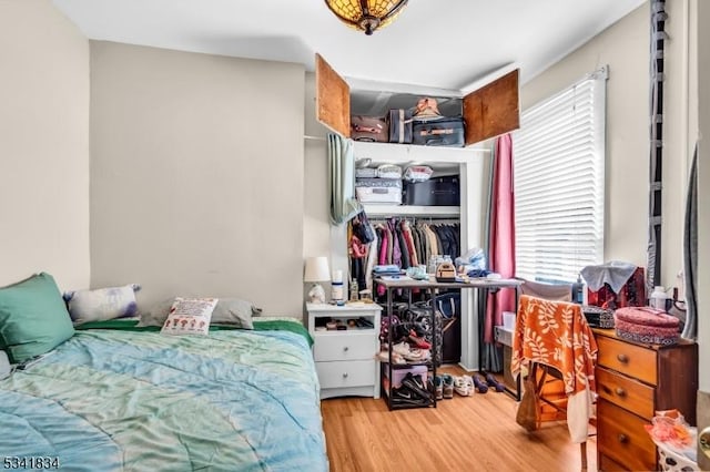 bedroom featuring a closet and wood finished floors