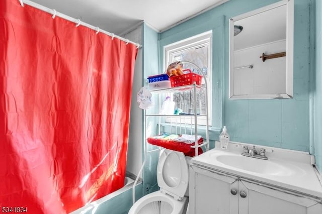 full bathroom featuring vanity, toilet, and shower / bath combo with shower curtain