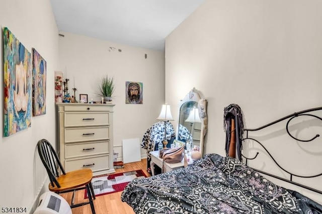 bedroom with light wood-style floors