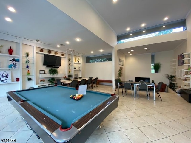 rec room with light tile patterned floors, rail lighting, built in features, and pool table