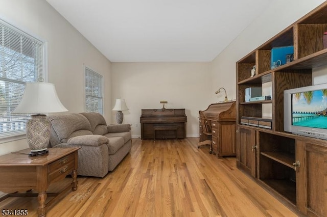 interior space featuring light wood-style flooring and baseboards