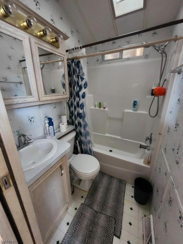 full bathroom featuring vanity, toilet, visible vents, and shower / tub combo with curtain