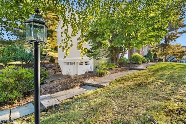 view of yard featuring a garage