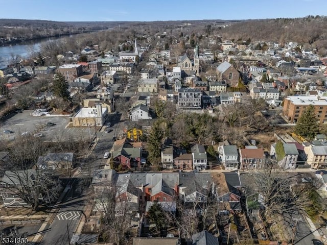 birds eye view of property with a residential view and a water view