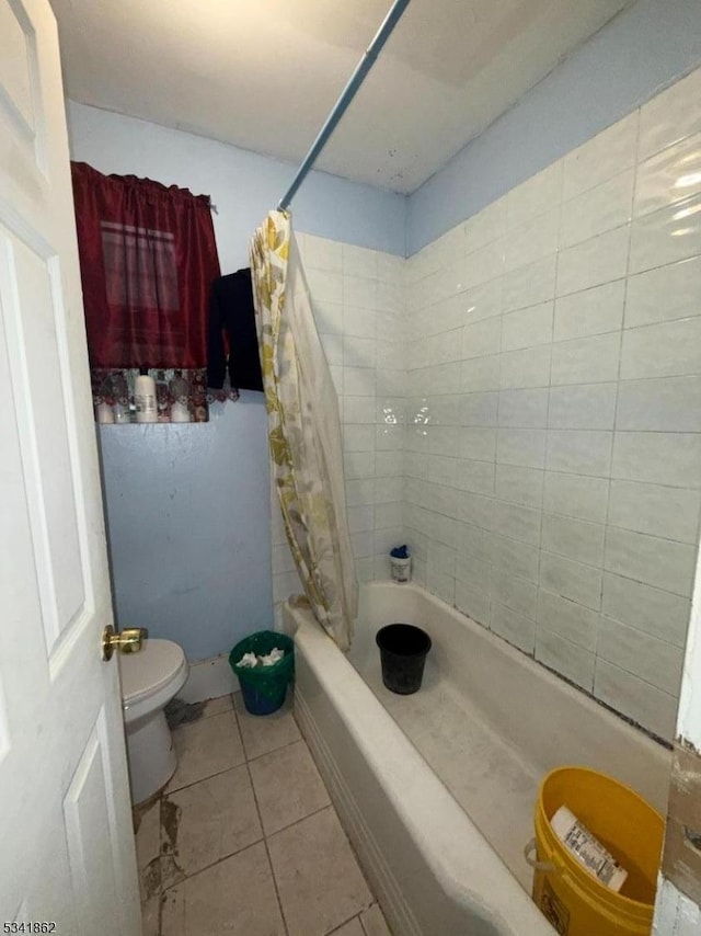 bathroom with toilet, tile patterned flooring, and shower / bathtub combination with curtain