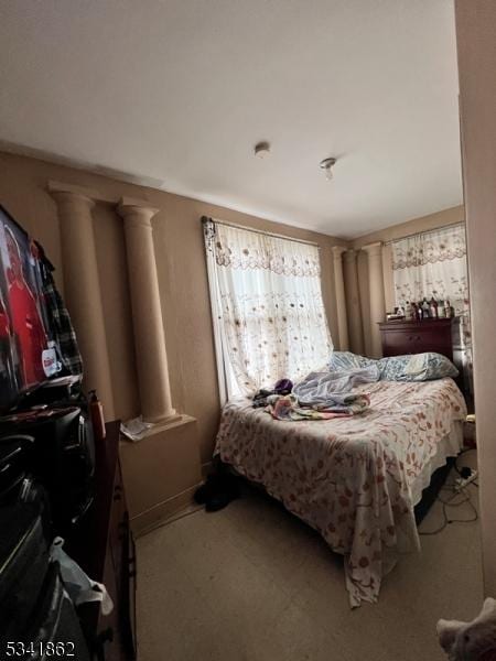 bedroom with decorative columns