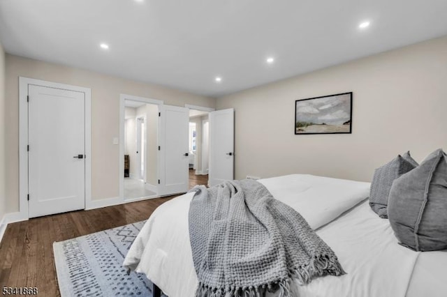 bedroom featuring recessed lighting, baseboards, and wood finished floors