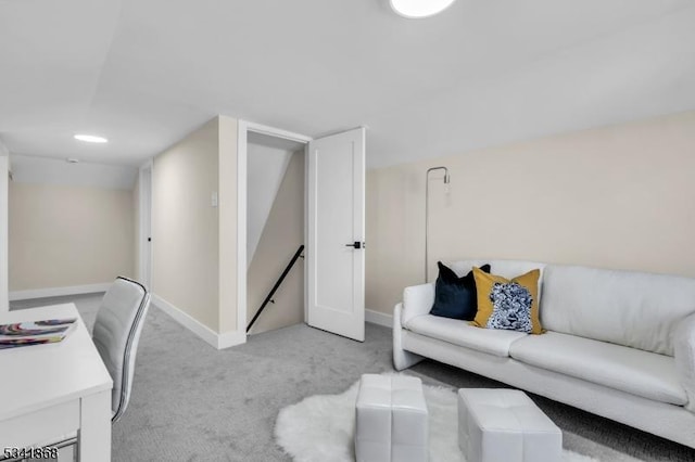 office area featuring baseboards and light colored carpet