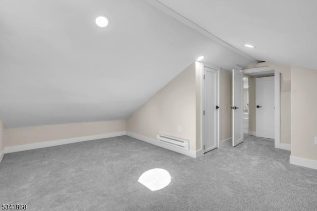 bonus room with lofted ceiling, carpet, and baseboards