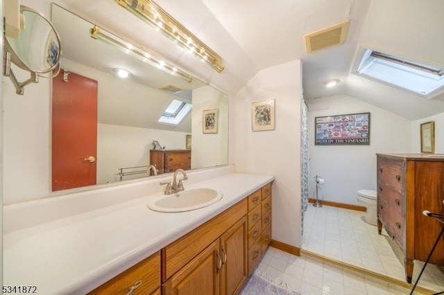 full bath with toilet, vaulted ceiling with skylight, vanity, and visible vents