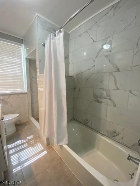 bathroom with shower / bath combination with curtain, toilet, and tile walls