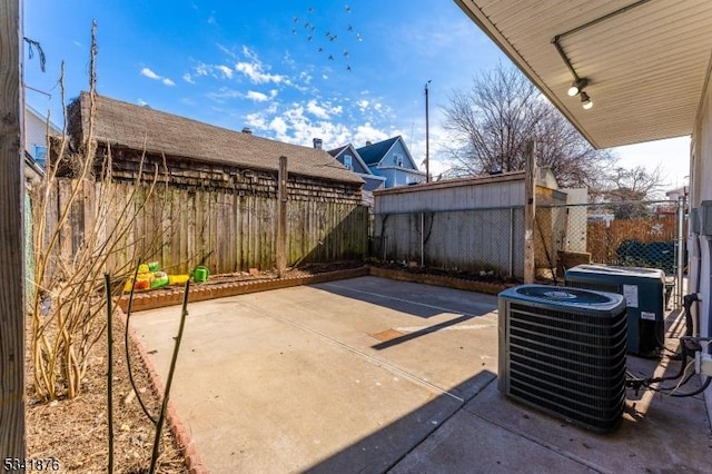 view of patio featuring a fenced backyard and cooling unit