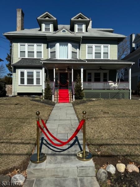 traditional style home featuring covered porch