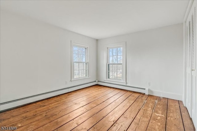 empty room with hardwood / wood-style floors