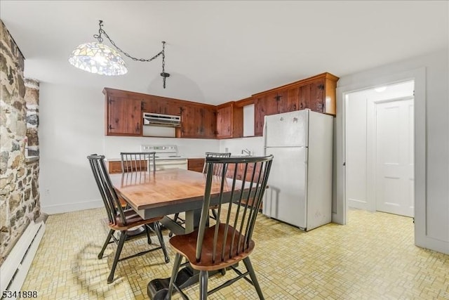 dining area featuring a baseboard radiator and baseboards