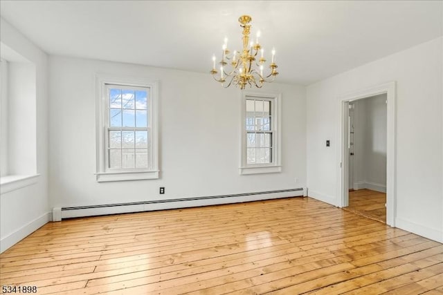 unfurnished room with light wood-type flooring, baseboards, a baseboard heating unit, and a chandelier