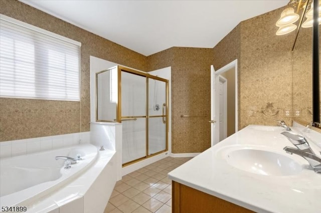 bathroom featuring a shower stall, wallpapered walls, a garden tub, and a sink