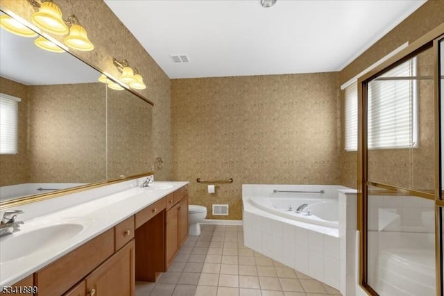 bathroom featuring tile patterned floors, visible vents, and a sink