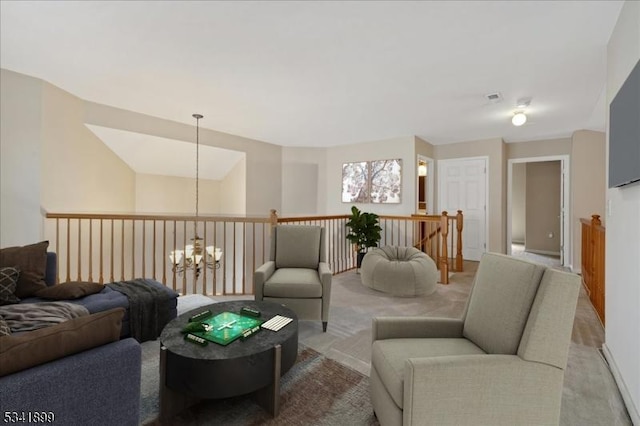 carpeted living room with a chandelier