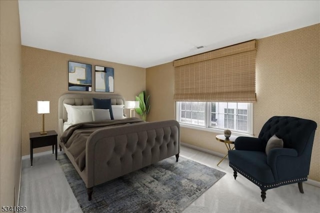 bedroom with carpet flooring and baseboards