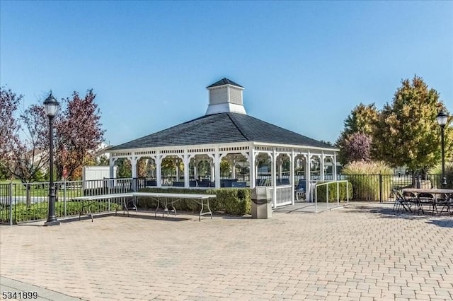 view of property's community featuring a gazebo and fence