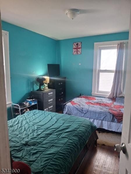 bedroom featuring hardwood / wood-style flooring