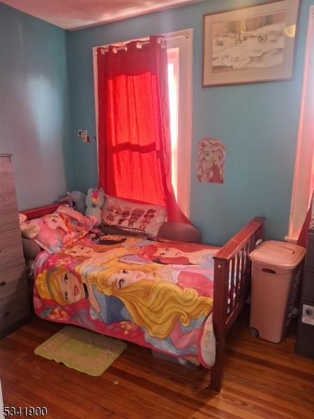 bedroom featuring wood finished floors