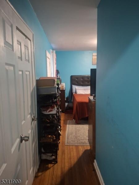 bedroom featuring wood finished floors