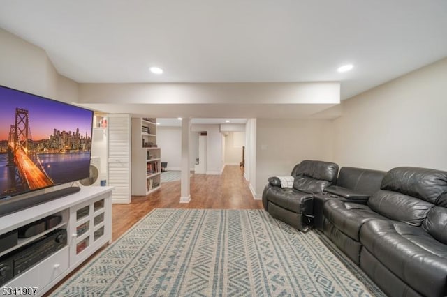 living area featuring recessed lighting and light wood-style flooring