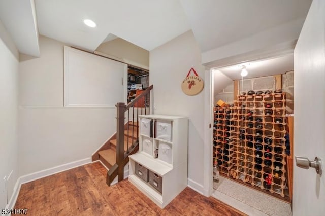 wine cellar featuring baseboards and wood finished floors