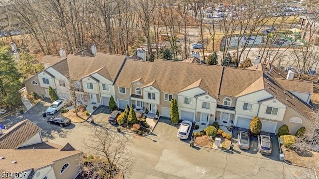 birds eye view of property with a residential view