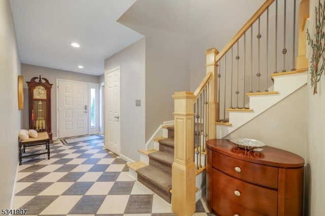 foyer featuring stairs, recessed lighting, baseboards, and tile patterned floors