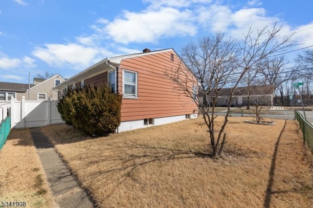 view of property exterior with fence