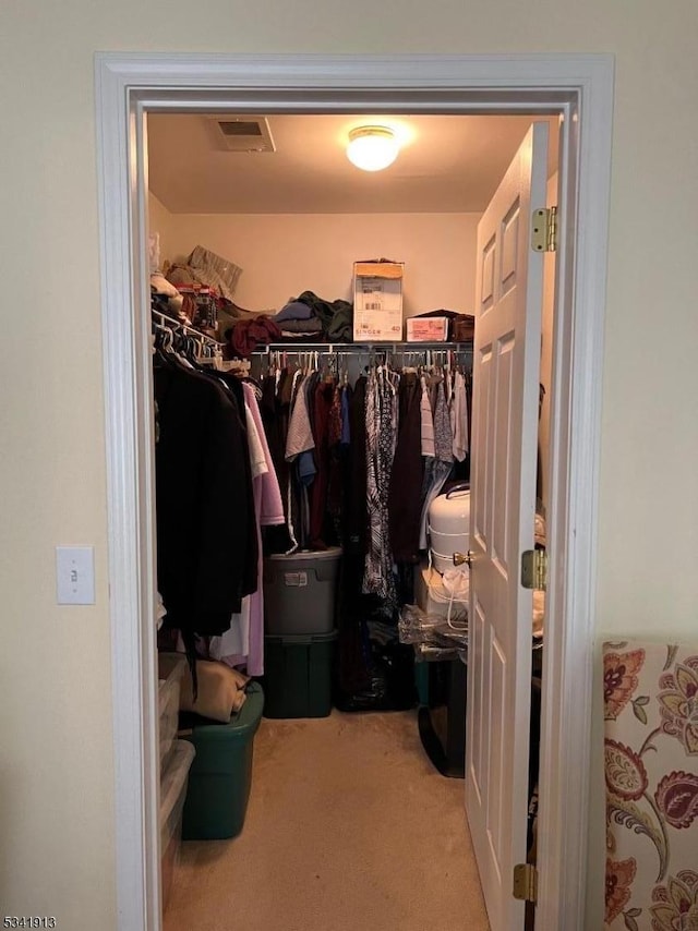 walk in closet with carpet flooring and visible vents