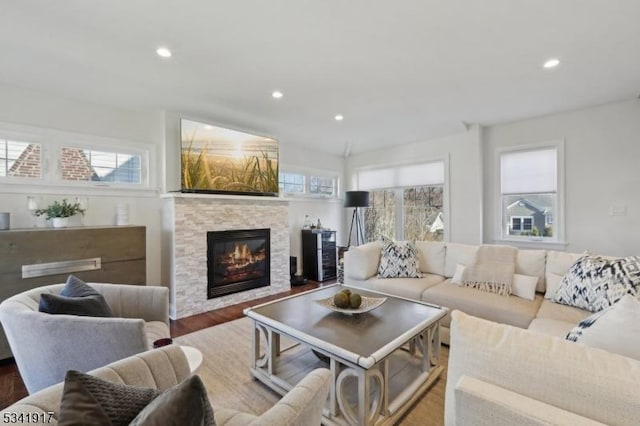 living area featuring a fireplace, wood finished floors, and recessed lighting