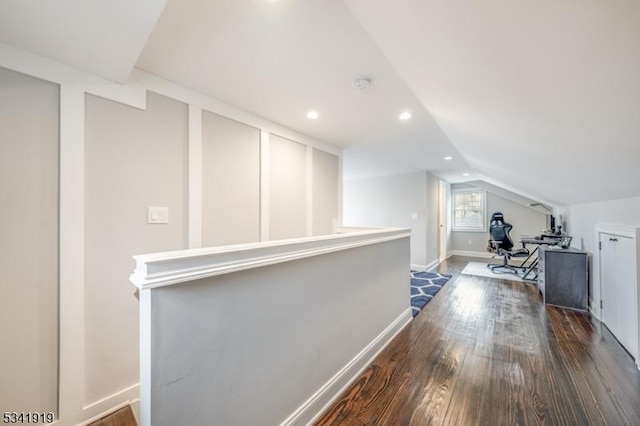 hallway with recessed lighting, an upstairs landing, baseboards, vaulted ceiling, and dark wood finished floors