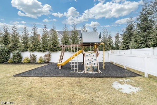 view of jungle gym featuring a yard and a fenced backyard