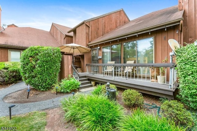 rear view of house with a deck