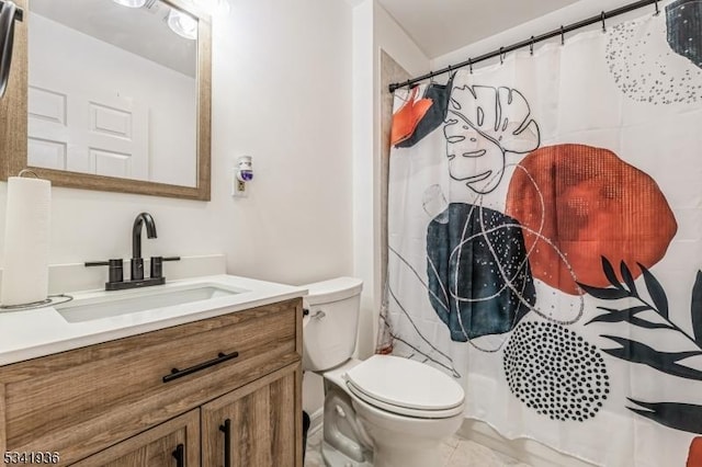 bathroom featuring toilet, curtained shower, and vanity