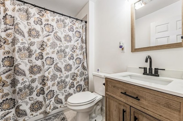 bathroom with toilet, a shower with shower curtain, and vanity