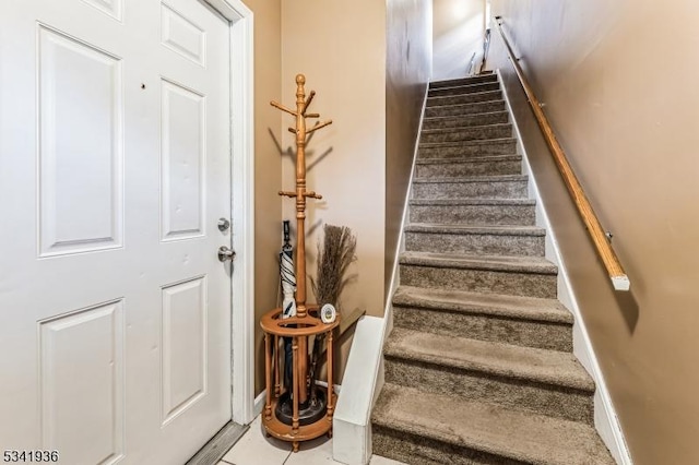 stairway with baseboards