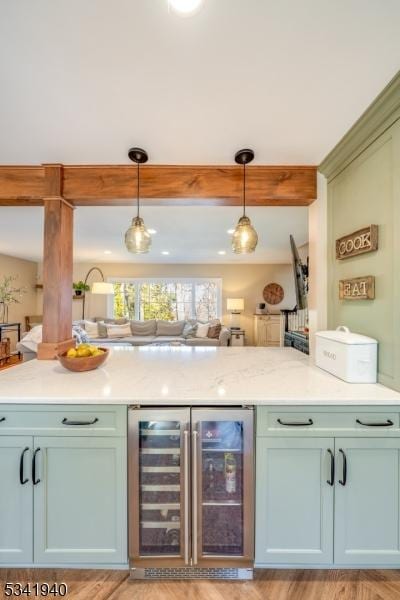 bar with wine cooler, pendant lighting, and beamed ceiling