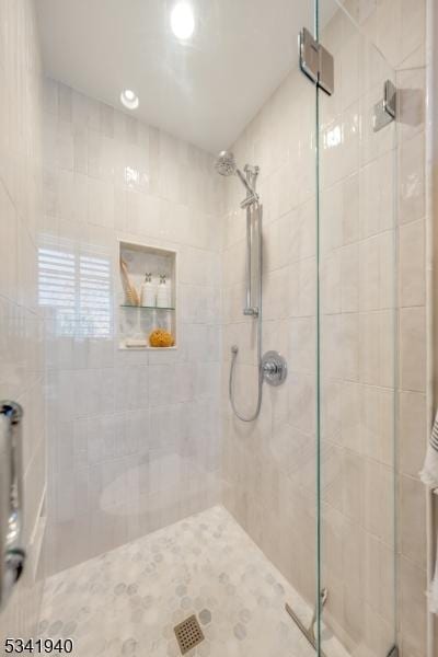 bathroom featuring a shower stall