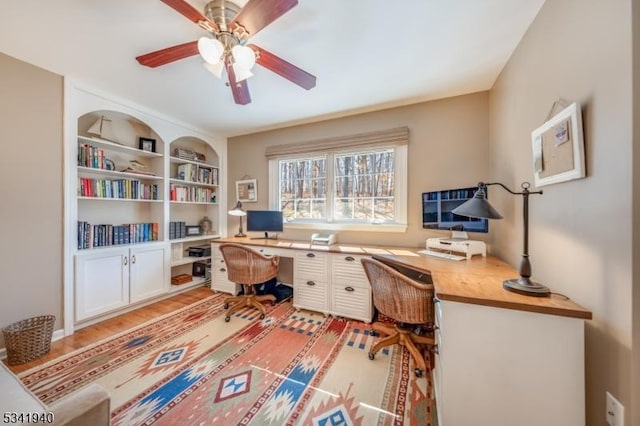 home office featuring light wood-style floors and ceiling fan