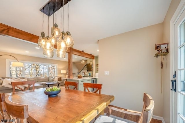 dining area featuring recessed lighting, wood finished floors, and baseboards